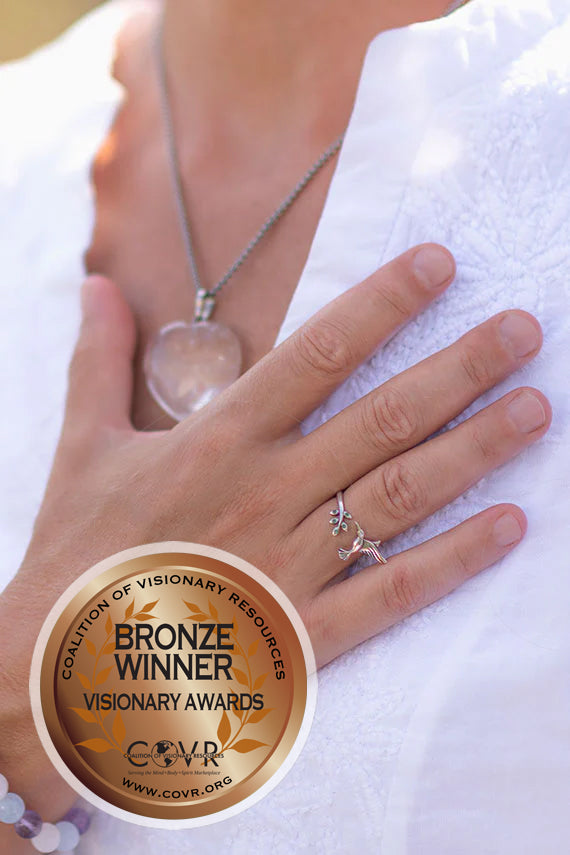 woman's hand placed on her heart